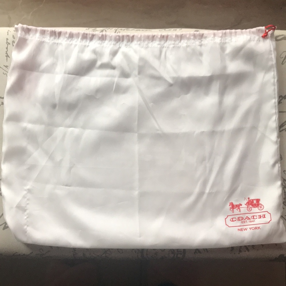 White Satin bag that Coach purses come in.